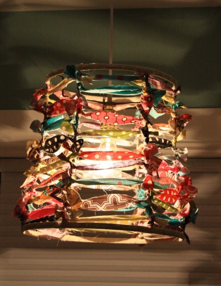 Fabric strips transform an old lamp shade skeleton.