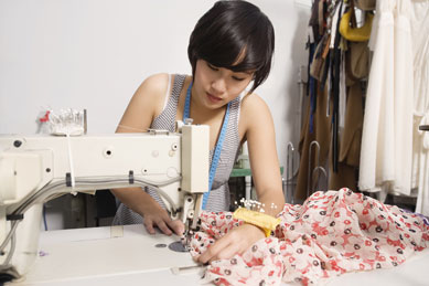 Woman sewing a dress